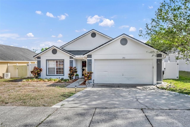 280 Bay St, Apopka, FL 32712 - ranch-style home featuring a gate, concrete driveway, stucco siding, fence, and a garage