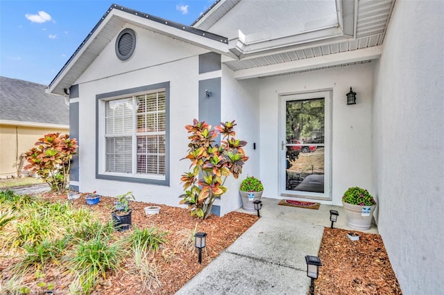280 Bay St, Apopka, FL 32712 - doorway to property featuring stucco siding