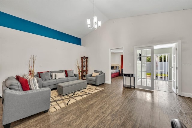 280 Bay St, Apopka, FL 32712 - living room featuring baseboards, high vaulted ceiling, wood finished floors, and a notable chandelier