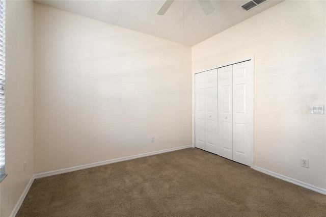 9723 Pecky Cypress Way, Orlando, FL 32836 - unfurnished bedroom with carpet floors, a closet, and a ceiling fan