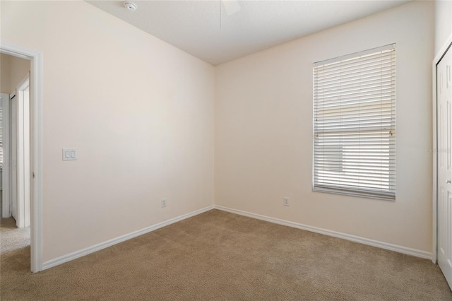 9723 Pecky Cypress Way, Orlando, FL 32836 - empty room with carpet floors, ceiling fan, and a smoke detector