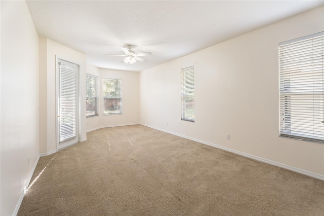 9723 Pecky Cypress Way, Orlando, FL 32836 - empty room featuring ceiling fan and light carpet