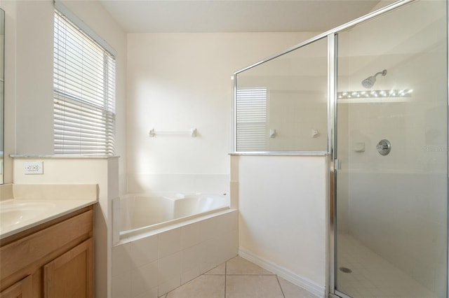 9723 Pecky Cypress Way, Orlando, FL 32836 - bathroom featuring vanity, a bath, a shower stall, and tile patterned floors