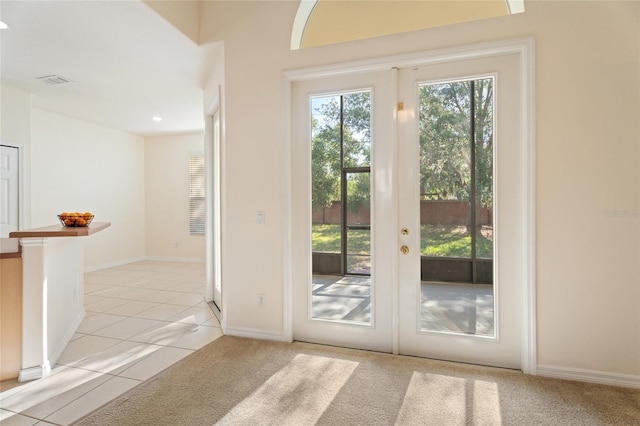 9723 Pecky Cypress Way, Orlando, FL 32836 - doorway to outside featuring light tile patterned floors, french doors, and recessed lighting