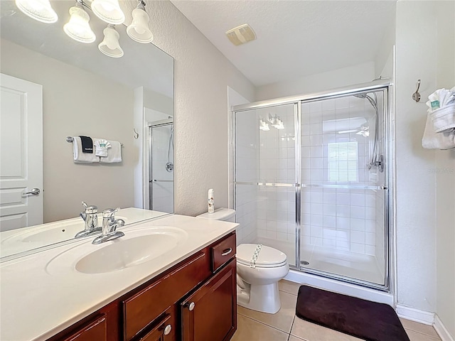 bathroom featuring a shower stall, tile patterned floors, and visible vents
