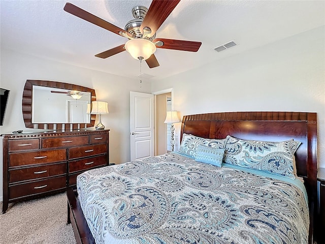 bedroom featuring a ceiling fan, carpet, and visible vents