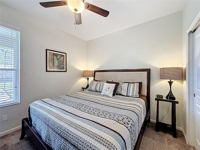 bedroom featuring carpet, baseboards, and ceiling fan