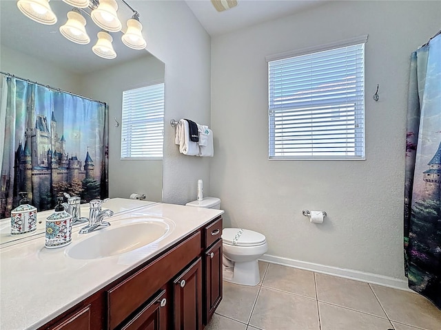 bathroom with vanity, baseboards, a chandelier, tile patterned floors, and toilet