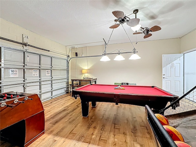 rec room with billiards, ceiling fan, and wood finished floors