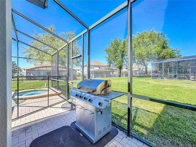sunroom featuring a jacuzzi and a healthy amount of sunlight