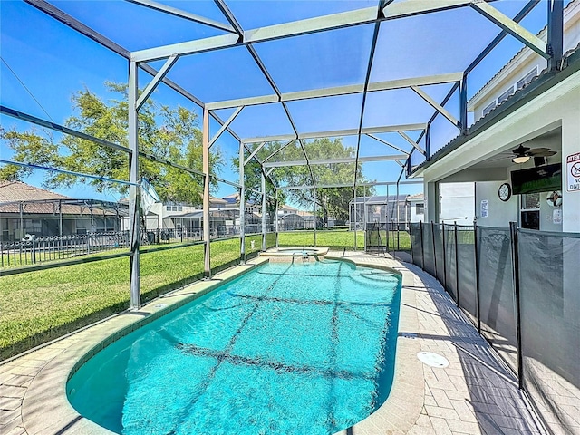 view of pool with a lawn, a fenced backyard, a patio area, and glass enclosure