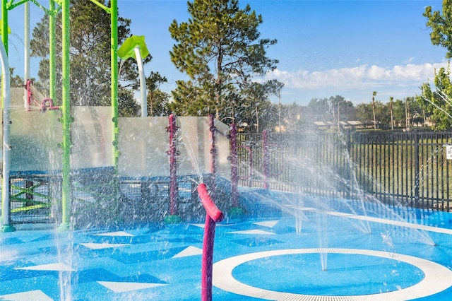view of swimming pool with fence