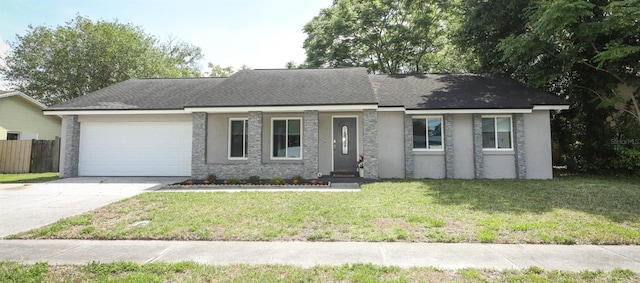 854 Escabar Dr, Altamonte Springs, FL 32714 - ranch-style home with driveway, a front yard, stucco siding, fence, and a garage