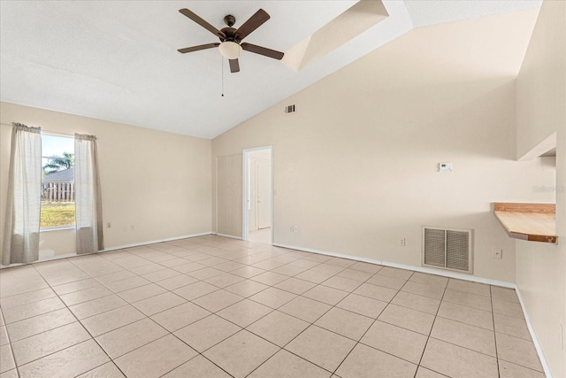 spare room featuring visible vents, a ceiling fan, high vaulted ceiling, and light tile patterned floors