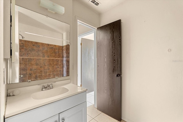bathroom with tile patterned floors, visible vents, and vanity