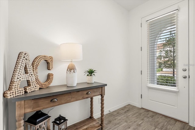 2710 Bolzano Dr, Apopka, FL 32712 - doorway to outside with light wood finished floors and baseboards