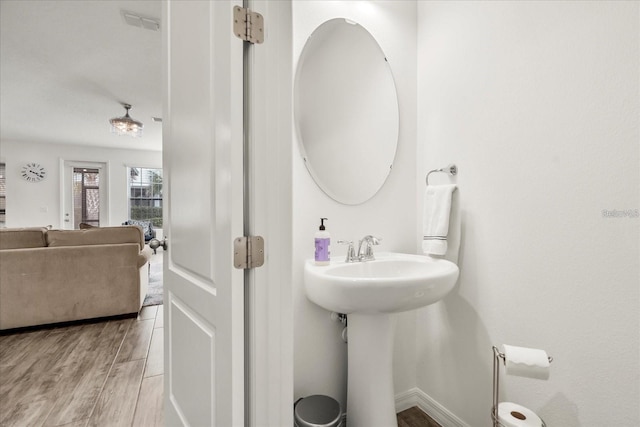 2710 Bolzano Dr, Apopka, FL 32712 - bathroom with a sink, visible vents, and wood finished floors
