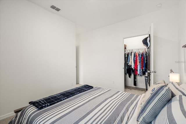 2710 Bolzano Dr, Apopka, FL 32712 - bedroom featuring light carpet, a walk in closet, visible vents, and a closet