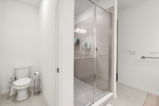 2710 Bolzano Dr, Apopka, FL 32712 - bathroom with toilet, tile patterned floors, baseboards, and a stall shower
