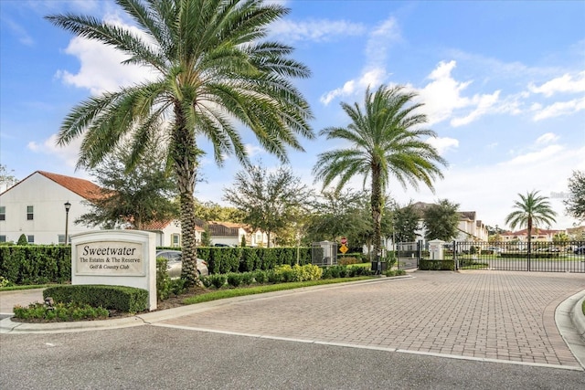 2710 Bolzano Dr, Apopka, FL 32712 - exterior space featuring fence, a residential view, and a gate