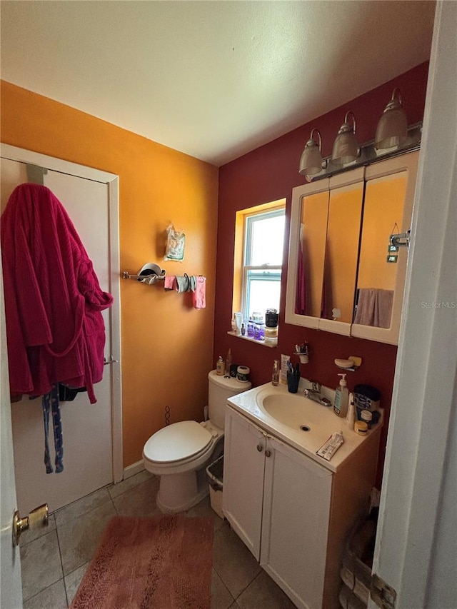3219 Chariot Pl, Orlando, FL 32818 - bathroom featuring toilet, vanity, and tile patterned flooring