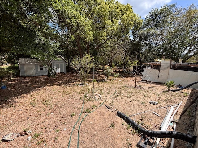 3219 Chariot Pl, Orlando, FL 32818 - view of yard featuring a storage unit and an outdoor structure