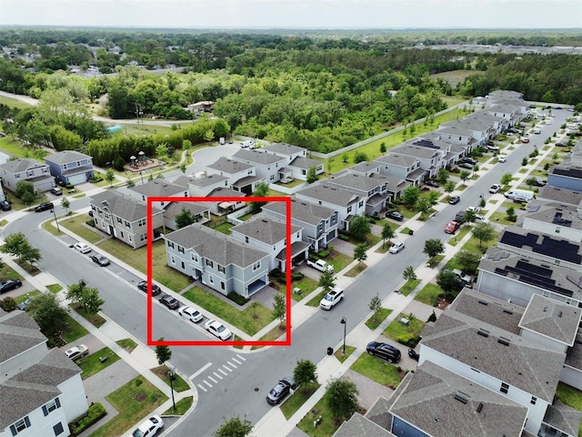 bird's eye view with a forest view and a residential view