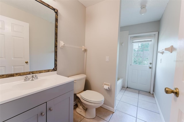 full bath featuring toilet, baseboards, tile patterned floors, and vanity