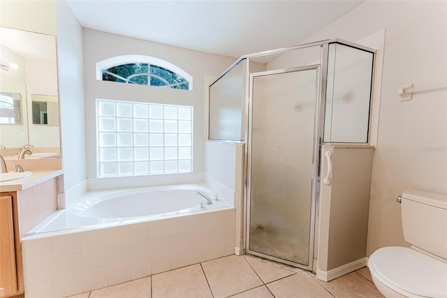 full bath with toilet, tile patterned flooring, a garden tub, and a shower stall