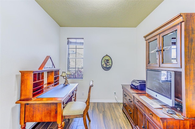 2626 Greenwillow Dr, Orlando, FL 32825 - office area featuring dark wood-style floors, baseboards, and a textured ceiling