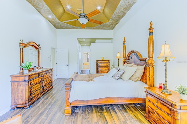 2626 Greenwillow Dr, Orlando, FL 32825 - bedroom with a tray ceiling, wood finished floors, and recessed lighting