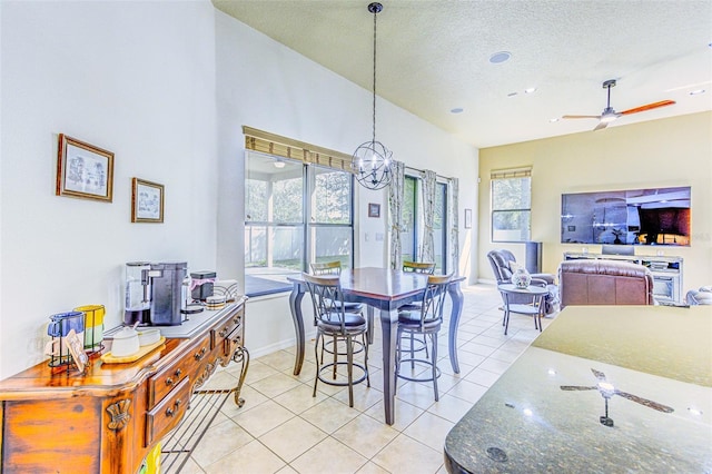 2626 Greenwillow Dr, Orlando, FL 32825 - dining area with healthy amount of natural light, light tile patterned floors, a textured ceiling, and a ceiling fan