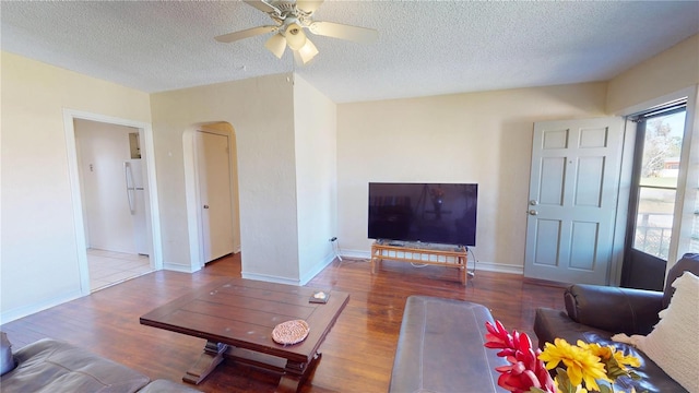 340 Zelda Blvd, Daytona Beach, FL 32118 - living area with wood finished floors, arched walkways, ceiling fan, a textured ceiling, and baseboards