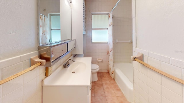 340 Zelda Blvd, Daytona Beach, FL 32118 - full bath featuring tile walls, toilet, vanity, tile patterned flooring, and shower / tub combo with curtain