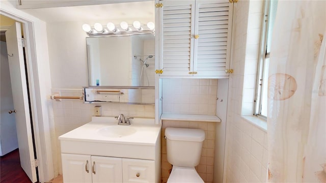 340 Zelda Blvd, Daytona Beach, FL 32118 - bathroom featuring tile walls, toilet, and vanity