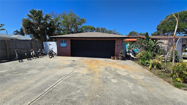 340 Zelda Blvd, Daytona Beach, FL 32118 - view of front of property with brick siding, a garage, and fence