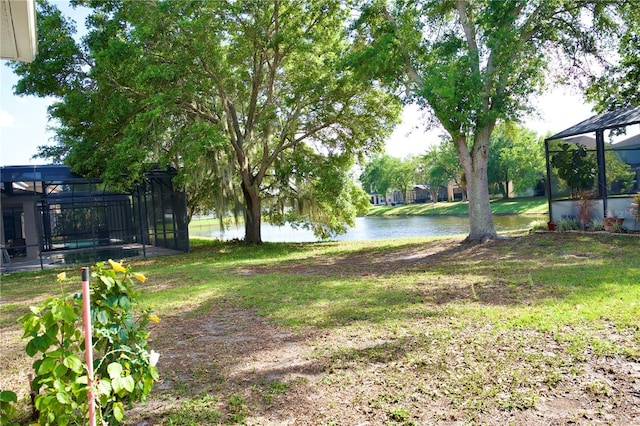 13520 Meadow Bay Loop, Orlando, FL 32824 - view of yard with a water view and a lanai