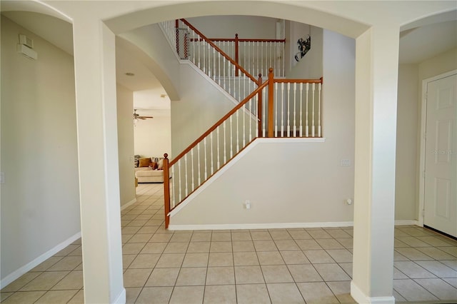 13520 Meadow Bay Loop, Orlando, FL 32824 - stairway featuring baseboards, tile patterned floors, and a ceiling fan