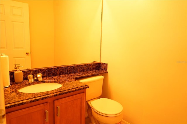 13520 Meadow Bay Loop, Orlando, FL 32824 - bathroom featuring baseboards, toilet, and vanity