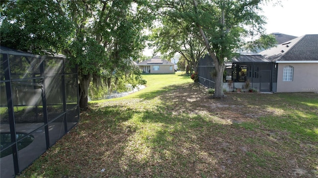 13520 Meadow Bay Loop, Orlando, FL 32824 - view of yard featuring a lanai