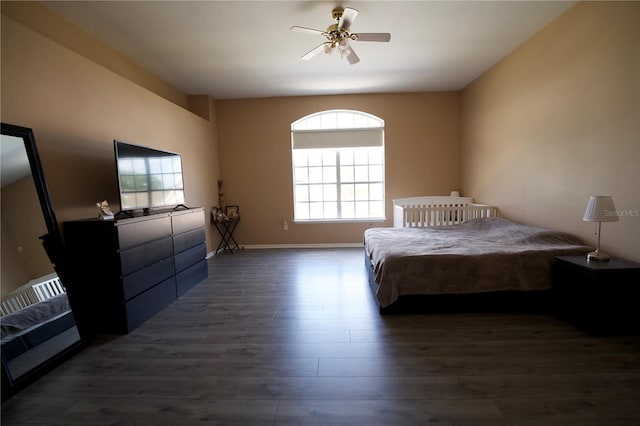 13520 Meadow Bay Loop, Orlando, FL 32824 - bedroom with dark wood-type flooring, baseboards, and a ceiling fan