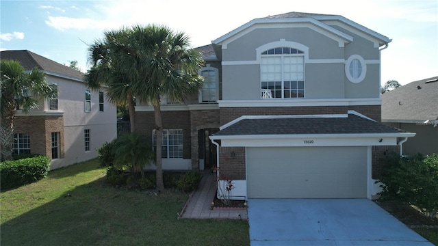 13520 Meadow Bay Loop, Orlando, FL 32824 - view of front facade featuring brick siding, driveway, a garage, and a front lawn