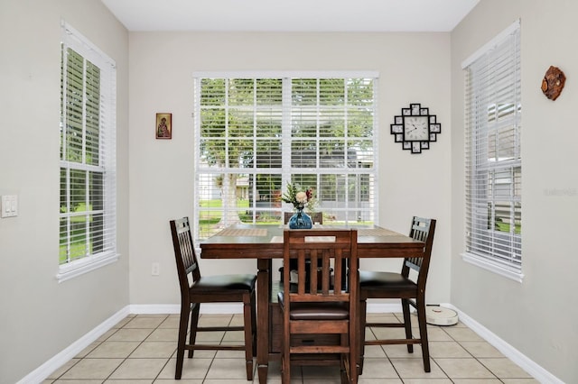 13520 Meadow Bay Loop, Orlando, FL 32824 - dining room featuring light tile patterned flooring and baseboards