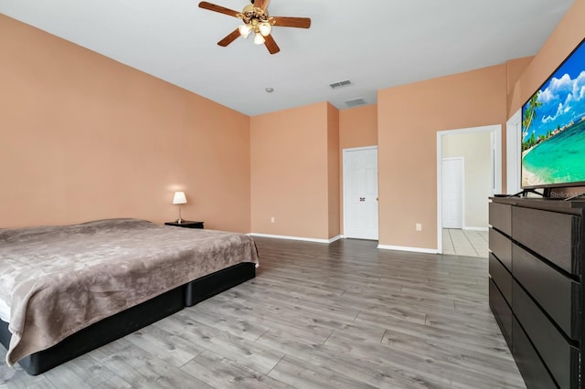 13520 Meadow Bay Loop, Orlando, FL 32824 - bedroom featuring wood finished floors and a ceiling fan