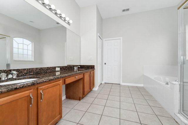 13520 Meadow Bay Loop, Orlando, FL 32824 - bathroom featuring double vanity, a bath, and tile patterned flooring