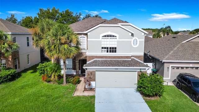 13520 Meadow Bay Loop, Orlando, FL 32824 - view of front facade with brick siding, a front yard, and driveway