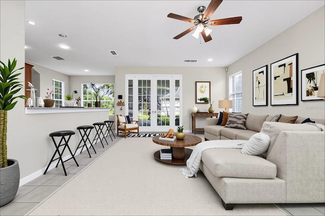13520 Meadow Bay Loop, Orlando, FL 32824 - living area with french doors, a ceiling fan, recessed lighting, and light tile patterned flooring