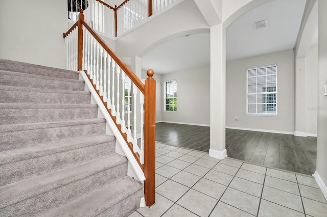 13520 Meadow Bay Loop, Orlando, FL 32824 - stairway with arched walkways and wood finished floors