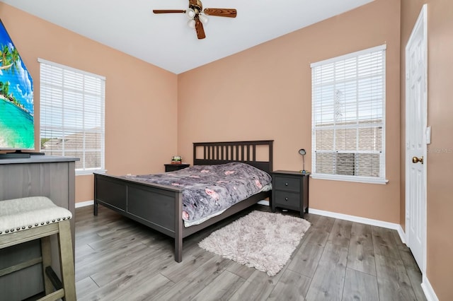 13520 Meadow Bay Loop, Orlando, FL 32824 - bedroom with wood finished floors and a ceiling fan
