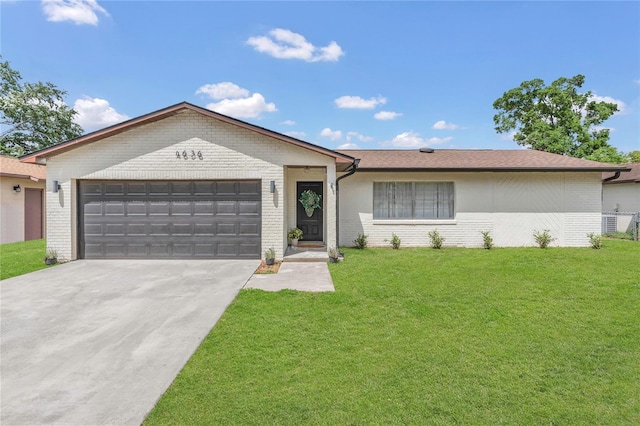 4636 Mesa Verde Dr, Saint Cloud, FL 34769 - ranch-style home featuring brick siding, a garage, driveway, and a front yard